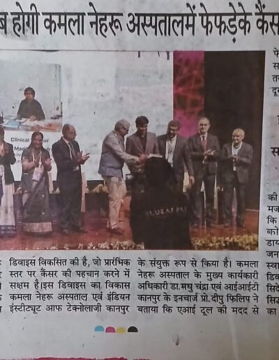 Group of professionals on a stage during an award ceremony at a conference.
