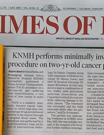 Newspaper front page with 'KNMH performs minimally invasive procedure on two-yr-old cancer patient' headline beside Times of India masthead.